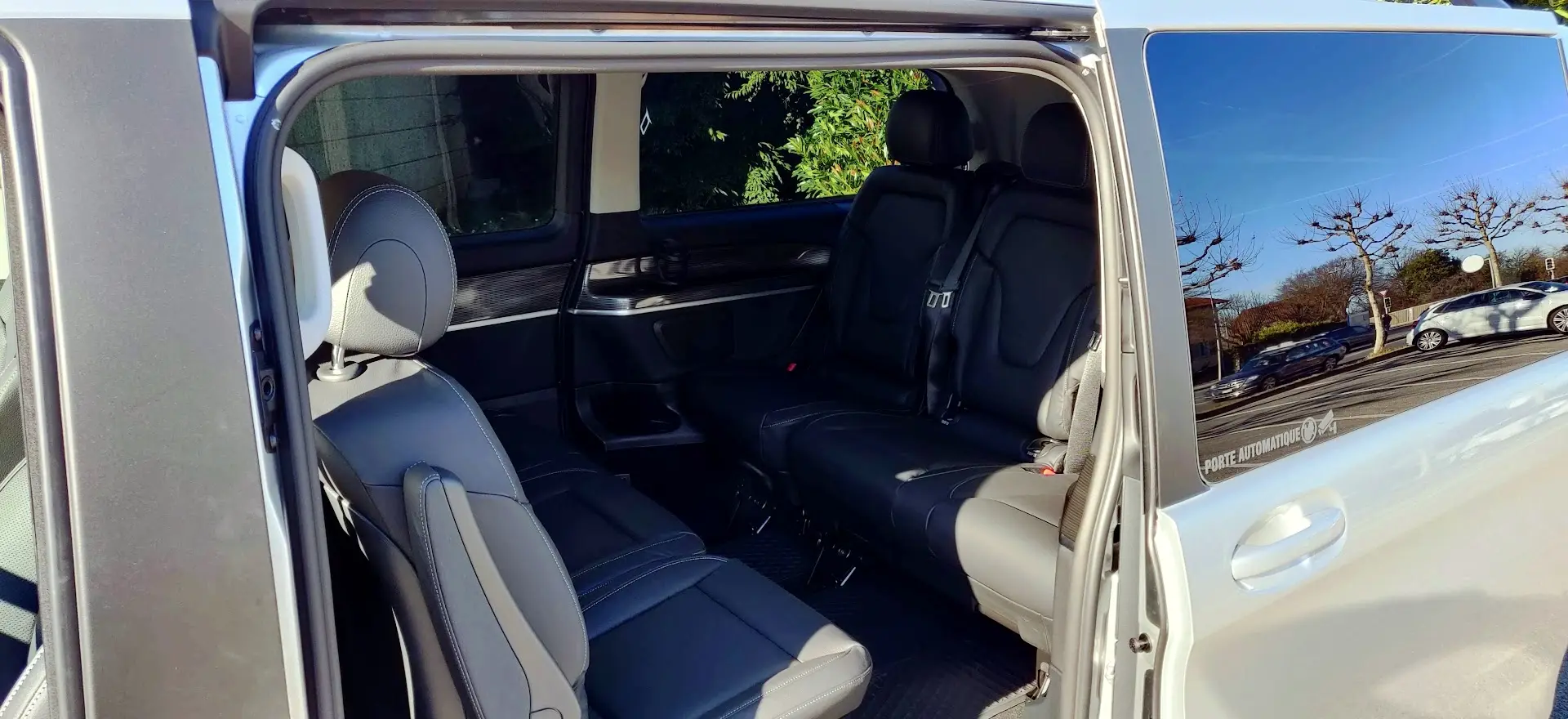 Interior of the Ned Taxi Geneva 7 seater van with leather seats and spacious layout